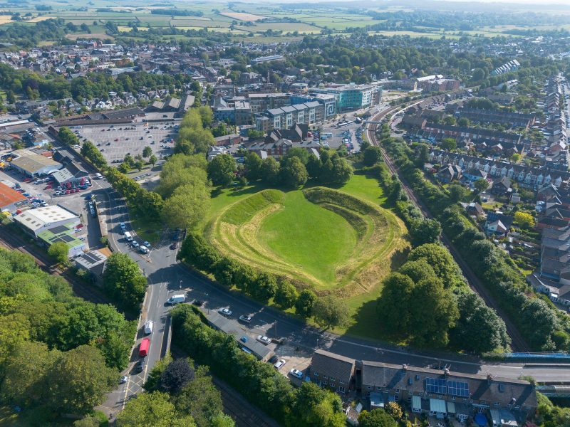 2XE1K9A Dorchester, Dorset, UK. 25th June 2024. UK Weather. Aerial view of Maumbury Rings amphitheatre at Dorchester in Dorset on a day of scorching hot sunshine. Maumbury Rings is a Neolithic henge located in the south of Dorchester. During the Roman occupation, the site was adapted as an amphitheatre for the use of the citizens of the nearby Roman town of Durnovaria (Dorchester). Picture Credit: Graham Hunt/Alamy Live News